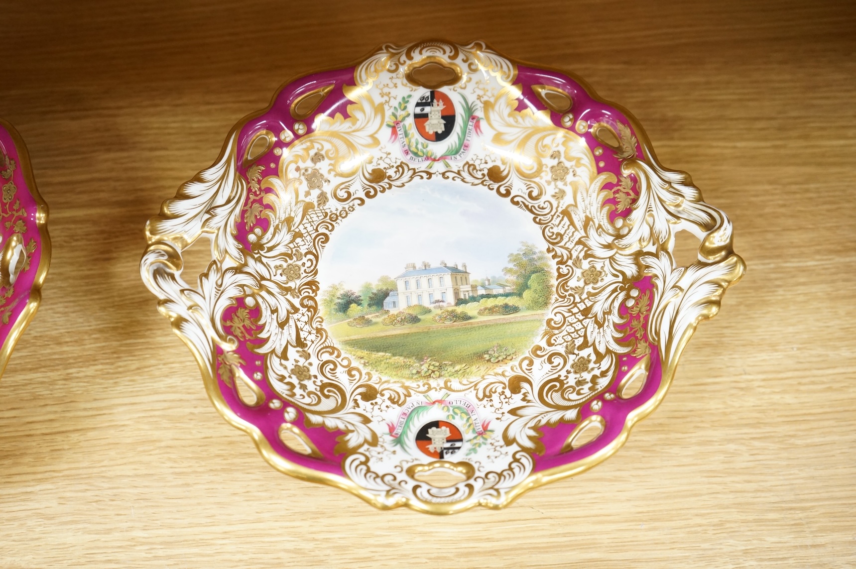 Four G Grainger, Worcester armorial porcelain comports, c.1845, hand painted with named views of Worcester, 24cm in diameter